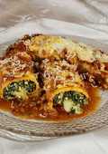 Canelones caseros de Verdura y Ricota con Tuco y Bologñesa